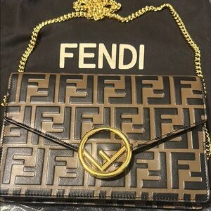 Fendi Brown and Black crossbody/Clutch with Gold Accent.